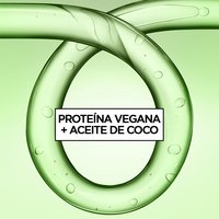 Green gel-textured rings with bubbles frame the text "Vegan Protein + Coconut Oil," highlighting Garnier Fructis Curl Refresher's key ingredients.