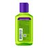 Back view of the lime-green curl oil bottle displaying usage instructions for scalp treatment, nourishing oil, and deep conditioning, plus ingredients and barcode information.