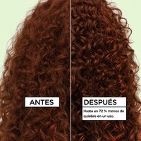 Before and after comparison of curly red hair showing up to 72% less breakage in one use after applying Garnier Curl Multi-Use Oil.