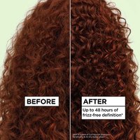 Before and after hair repair comparison on red curly hair: visibly showing up to 48 hours of frizz-free definition using the Garnier Fructis Curl Nourish hair care system.