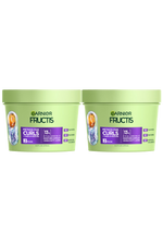 Two light green tubs of Garnier Fructis Method for Curls Mask are displayed. Each tub is labeled "METHOD FOR CURLS UP TO 1 WEEK OF MOISTURE," indicating it's a "MASK" with "13% HYALURONIC MOISTURE COMPLEX + SHEA FATTY ACIDS." It also states "NO SULFATES, NO SILICONES, NO ARTIFICIAL COLORANTS."