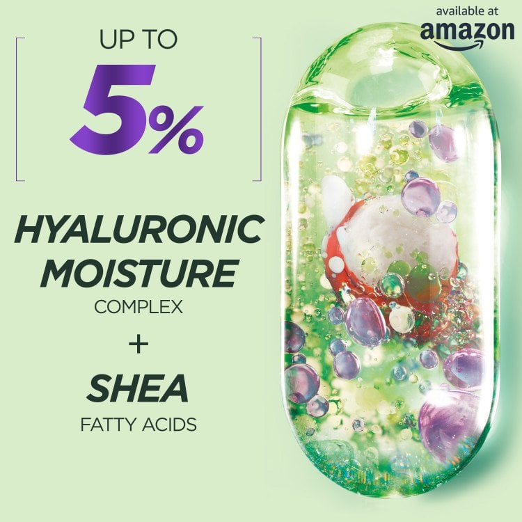 A close-up image highlighting the key ingredients: "UP TO 5% HYALURONIC MOISTURE COMPLEX + SHEA FATTY ACIDS," with a visual representation of the complex inside a clear, oval-shaped container, similar to the packaging design. The "available at amazon" logo is in the top right.