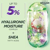 A close-up image highlighting the key ingredients: "UP TO 5% HYALURONIC MOISTURE COMPLEX + SHEA FATTY ACIDS," with a visual representation of the complex inside a clear, oval-shaped container, similar to the packaging design. The "available at amazon" logo is in the top right.