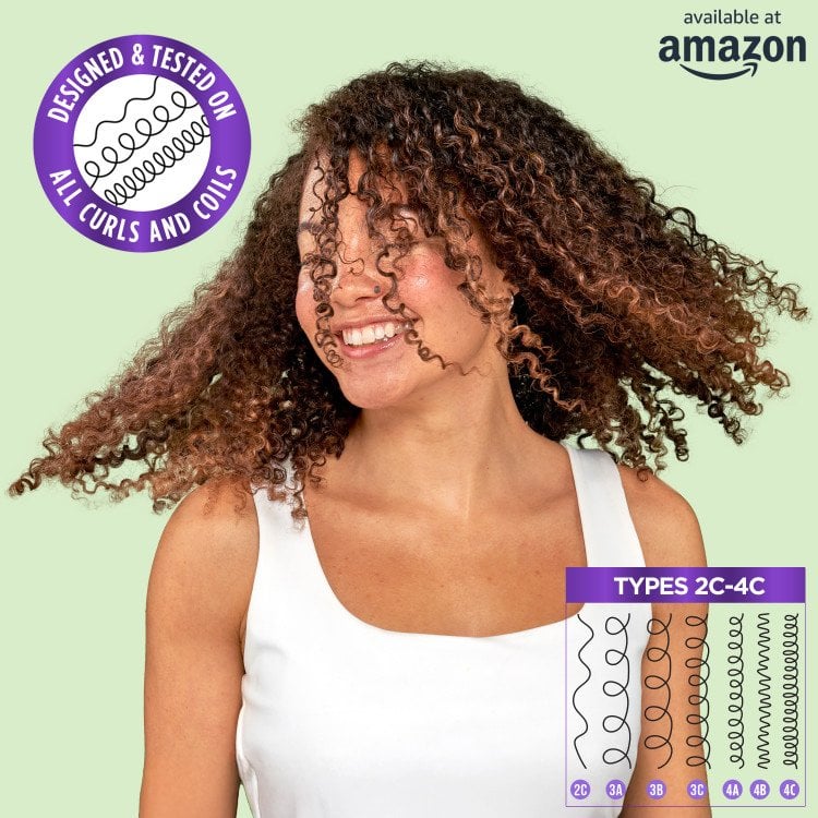 A dynamic shot of a smiling woman with voluminous brown curly hair, reinforcing that the product is "DESIGNED FOR & TESTED ON ALL CURLS AND COILS (TYPES 2C-4C)." A graphic illustrating different curl patterns (2C through 4C) is also present. The "available at amazon" logo is in the top right.