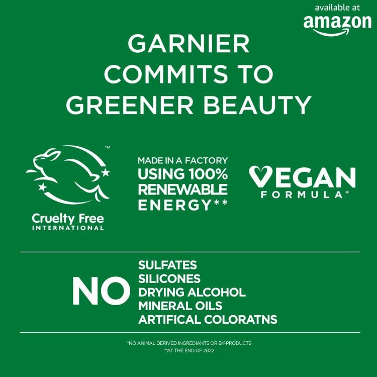 An informational graphic stating "GARNIER COMMITS TO GREENER BEAUTY," featuring logos for Cruelty Free International and "VEGAN FORMULA," and indicating "MADE IN A FACTORY USING 100% RENEWABLE ENERGY." It also prominently states "NO SULFATES SILICONES DRYING ALCOHOL MINERAL OILS ARTIFICAL COLORATNS." The "available at amazon" logo is in the top right.