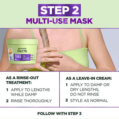 Garnier Fructis 'Step 2 Multi-Use Mask' shown with a hand holding curly hair. Instructions for use as a rinse-out treatment or a leave-in cream are provided.