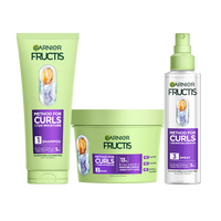 A complete set of Garnier Fructis Method for Curls products is displayed: a light green tube of “Moisture Restoring Shampoo“, a light green tub of “Defining Mask“ and a clear spray bottle of “Reviving Spray" for 48H moisture & definition and for up to 1 week of moisture. All products highlight "Hyaluronic Moisture Complex + Shea Fatty Acids."
