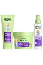 A complete set of Garnier Fructis Method for Curls products is displayed: a light green tube of “Moisture Restoring Shampoo“, a light green tub of “Defining Mask“ and a clear spray bottle of “Reviving Spray" for 48H moisture & definition and for up to 1 week of moisture. All products highlight "Hyaluronic Moisture Complex + Shea Fatty Acids."