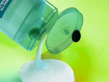 Conditioner dispensing from the Garnier Fructis Pure Clean Conditioner bottle. This light-weight formula is gentle for every day use