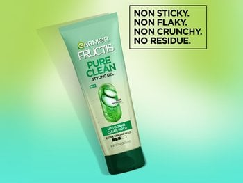 A bottle of Garnier Frucits Pure Clean Styling Gel, which offers up to 24 hours of lasting control and definition in a non sitcky formula.