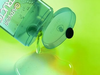 Shampoo dispensing from the Garnier Fructis Pure Clean Shampoo bottle. This light-weight formula is gentle for every day use