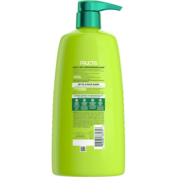 Green bottle of Fructis Sleek & Shine conditioner, back view.