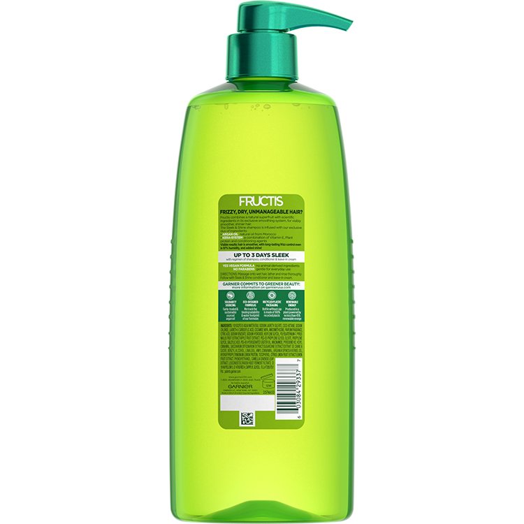 Large green bottle of Fructis Sleek & Shine shampoo, back view.