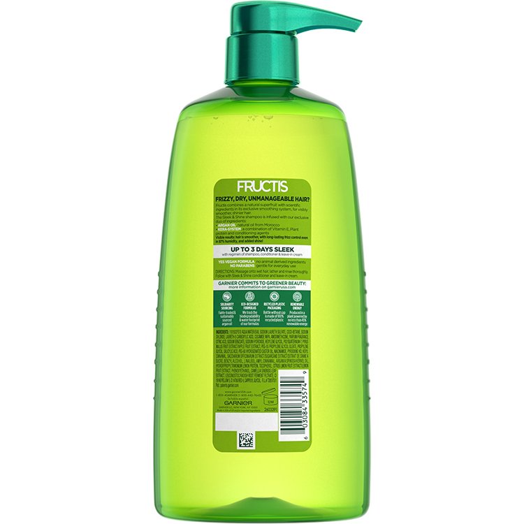 Green bottle of Fructis Sleek & Shine shampoo, back view.