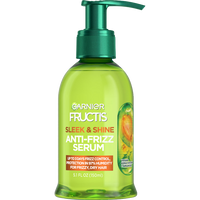 Front of a Garnier Fructis Sleek & Shine Anti-Frizz Serum bottle, highlighting "Vegan Kera System + Argan Oil" and benefits like "Up to 3 days frizz control, protection in 97% humidity for frizzy, dry hair."