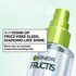 A close-up of a Garnier Fructis Diamond Sleek Shine spray bottle, actively spritzing a fine mist. Text claims "UP TO 100HR OF FRIZZ-FREE SLEEK. DIAMOND-LIKE SHINE." and instructs to "Blow-dry to activate expensive-looking hair.