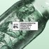 Close up shot of liquid inside a glass chemical device. Bubbles and rings are forming in an abstract way. Copy on image reads "up to 8% vegan keratin smoothing complex + argan oil".