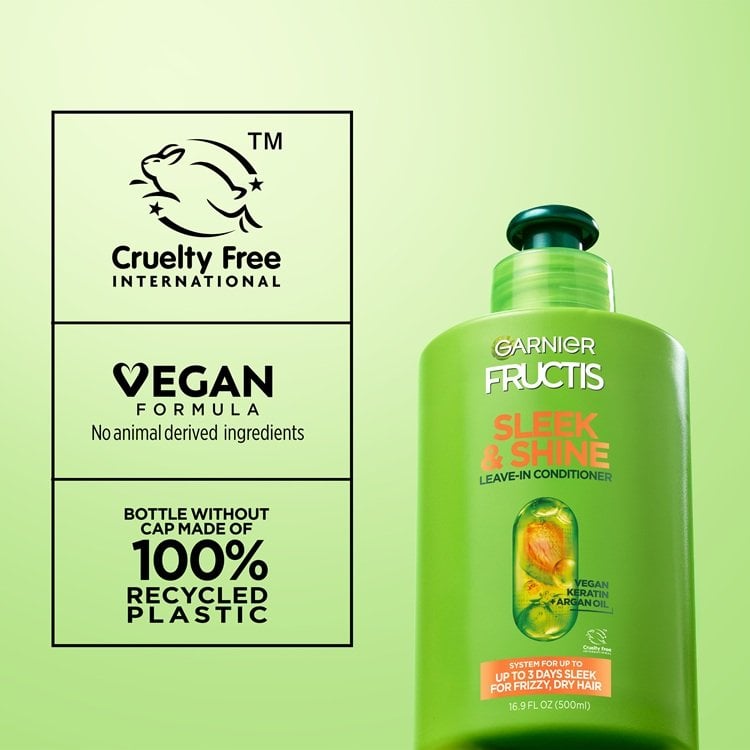 A bottle of Garnier Fructis Sleek & Shine Leave-In Conditioner on the right side, while the left side features claims such as "Cruelty Free International", "Vegan Formula, No animal derived ingredients" and "Bottle without cap made of 100% recycled plastic", indicating Garnier's Greener Beauty commitments.