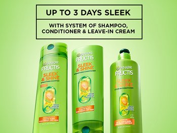 Group shot of Sleek & Shine Frizz Control System, Smoothing Shampoo, Smoothing Conditioner, and Smoothing Leave-In Conditioner. Copy reads, "Up to 3 days of sleek with system of Shampoo, Conditioner, and Leave-In Cream."