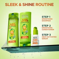 Garnier Fructis Sleek & Shine routine with shampoo, conditioner, and heat-activated serum.
