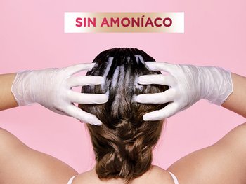 Model applying Color Retouch to hair with gloves.