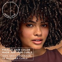 A woman with voluminous curls; text highlights 100% gray coverage and 3x glossier curls for curly hair.