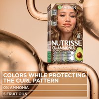 A promotional graphic for Shade CR6 (Golden Brown) with text stating the formula protects curl patterns using 0% ammonia and 5 fruit oils.