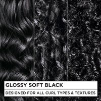 Three close-up hair panels demonstrating the Glossy Soft Black color on wavy, curly, and coily textures. Text reads: "DESIGNED FOR ALL CURL TYPES & TEXTURES."