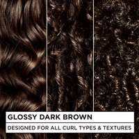 Three close-up hair swatches demonstrating the Glossy Dark Brown color on wavy, curly, and coily textures. Text reads: "DESIGNED FOR ALL CURL TYPES & TEXTURES."