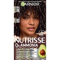 Vertical box of Garnier Nutrisse 0% Ammonia Glossy Curl Color in Shade CR4 Glossy Dark Brown, featuring a woman with voluminous dark brown curls and an avocado graphic.