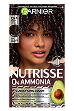 Vertical box of Garnier Nutrisse 0% Ammonia Glossy Curl Color in Shade CR4 Glossy Dark Brown, featuring a woman with voluminous dark brown curls and an avocado graphic.