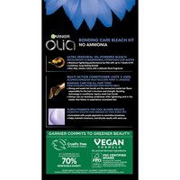 Vertical marketing panel for Garnier Olia No Ammonia Bonding Care Bleach Kit set against a dark navy background with blue floral accents in the upper left. The Olia logo and product name appear at the top. A prominent bright green callout box at the bottom highlights: "VEGAN" and states "70%" alongside a claim about ingredients committed to greener beauty. Additional product benefit copy appears in smaller white text above.