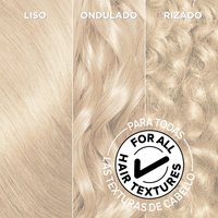 Close-up flat-lay of three bleached, lightened hair texture samples side by side labeled "STRAIGHT," "WAVY," and "CURLY" against a warm beige background. A circular badge overlay reads: "FOR ALL HAIR TEXTURES" with a checkmark icon, communicating that the Garnier Olia Bonding Care Bleach Kit is suitable for all hair types.