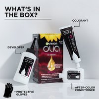 Image showing the contents of the Garnier Olia hair color box, including the colorant, developer, after-color conditioner, and protective gloves.