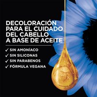 Dark navy promotional graphic for Garnier Olia featuring a large, glistening golden oil droplet at center-right with soft blue flowers in the background. Bold white headline text reads: "OIL POWERED BONDING CARE BLEACH." Below, a bulleted checklist in white reads: "✓ No Ammonia ✓ No Silicones ✓ No Parabens ✓ Vegan Formula."