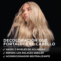 A woman with long, wavy, platinum blonde hair poses against a solid black background, looking slightly downward with a cool, confident expression. Overlaid white text on the left reads: "BONDING CARE BLEACH" followed by a bulleted claim list: "✓ Up to 7 Levels of Lift ✓ Repairs Weak Bonds ✓ Neutralizing Bonding Conditioner."