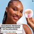 Smiling woman holding a cotton pad near her eye, captioned "Dermatologist & Ophthalmologist Tested for Safety, for face, eyes & lips.