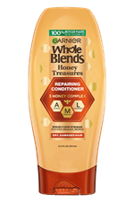 Garnier Whole Blends Honey Treasures Repairing Conditioner 12.5 fl oz bottle: a repairing hair treatment infused with a 3 honey complex to treat breakage and dryness.
