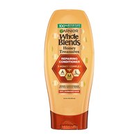 Garnier Whole Blends Honey Treasures Repairing Conditioner 12.5 fl oz bottle: a repairing hair treatment infused with a 3 honey complex to treat breakage and dryness.