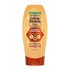 Garnier Whole Blends Honey Treasures Repairing Conditioner 12.5 fl oz bottle: a repairing hair treatment infused with a 3 honey complex to treat breakage and dryness.