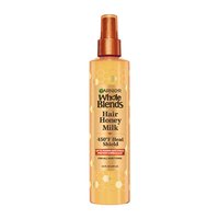 A front visual of the Garnier Whole Blends Honey Treasures Repairing Milk Honey Spray bottle.