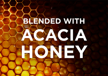 Graphic of honeycomb structure fading from golden yellow/brown to black with the words “BLENDED WITH ACACIA HONEY” written in white on top.