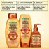 Garnier Whole Blends Honey Treasures 4-step hair repair routine: featuring repairing shampoo, conditioner, rich repairing mask, and hair honey serum for nourished, healthy hair.