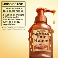 How to use Garnier Whole Blends Hair Honey Repairing Serum: dispense half a pump for damp or dry hair ends to repair damage and smooth frizz without rinsing.