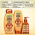 Garnier Whole Blends Honey Treasures 4-step hair repair routine: featuring repairing shampoo, conditioner, rich repairing mask, and hair honey serum for nourished, healthy hair.
