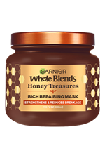 Garnier Whole Blends Honey Treasures Rich Repairing Mask hero shot: intensive hair treatment jar designed to repair the three main signs of damage: split ends, breakage, and dryness.