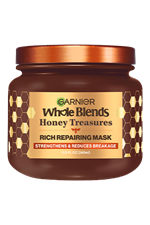 Garnier Whole Blends Honey Treasures Rich Repairing Mask hero shot: intensive hair treatment jar designed to repair the three main signs of damage: split ends, breakage, and dryness.