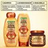 Complete 3-step Garnier Whole Blends Honey Treasures repairing system: featuring repairing shampoo, repairing conditioner, and rich repairing mask for a comprehensive damaged hair care routine.
