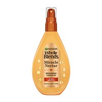 Garnier Whole Blends Miracle Nectar Repairing Leave-In 5.1 fl oz bottle: a honey-infused 10-in-1 treatment for all hair types featuring damaged hair repair.