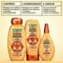 Complete 3-step Garnier Whole Blends Honey Treasures hair care system: 1. Repairing Shampoo, 2. Repairing Conditioner, and 3. Miracle Nectar Leave-In Treatment.